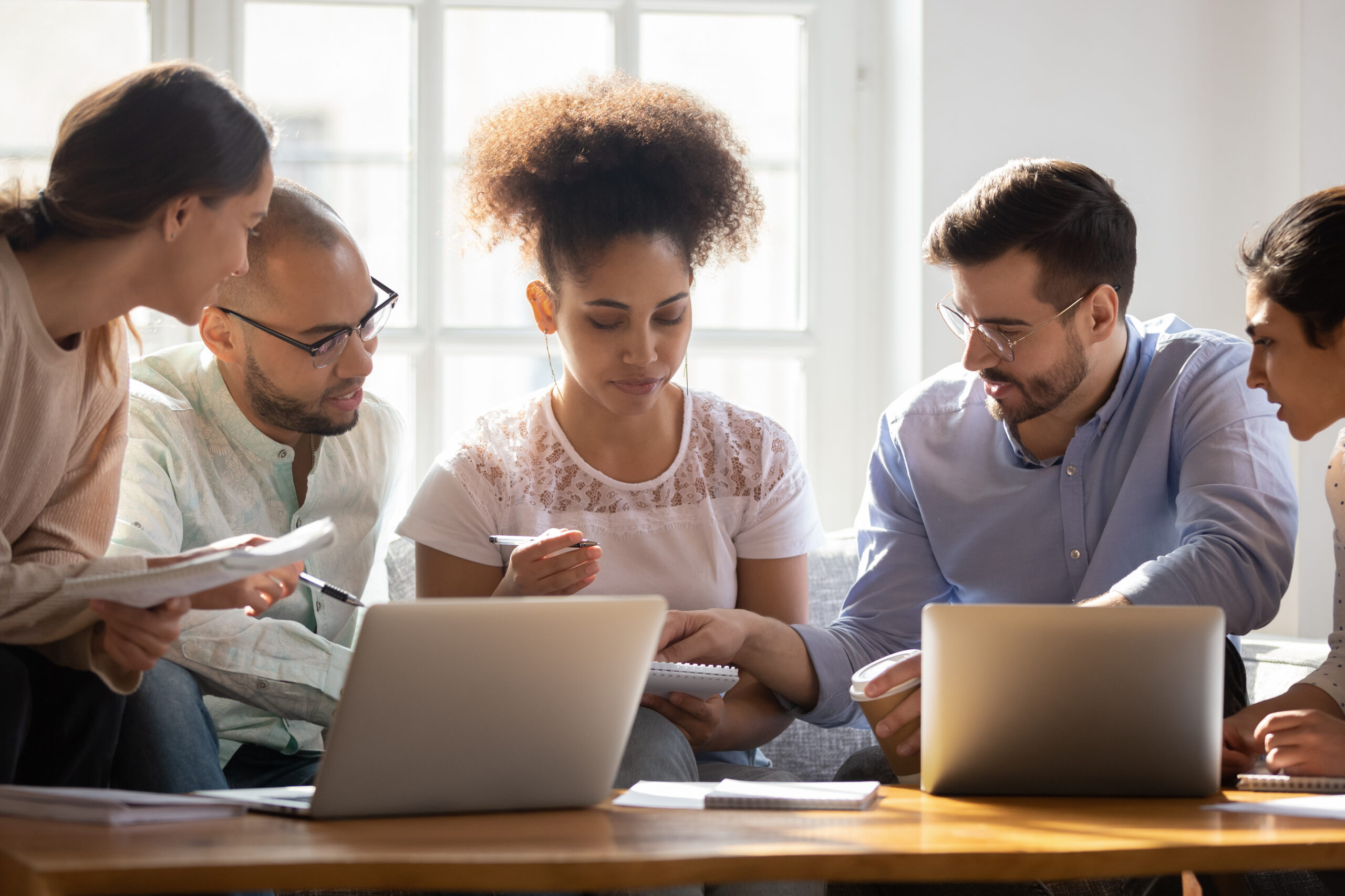 Multiethnic diverse students brainstorm preparing for exam together