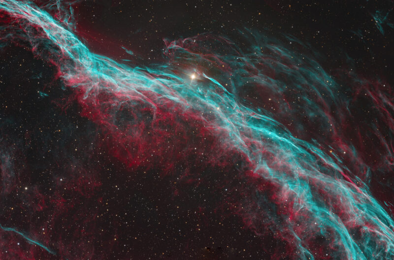 Red and blue swirls in the universe with stars
