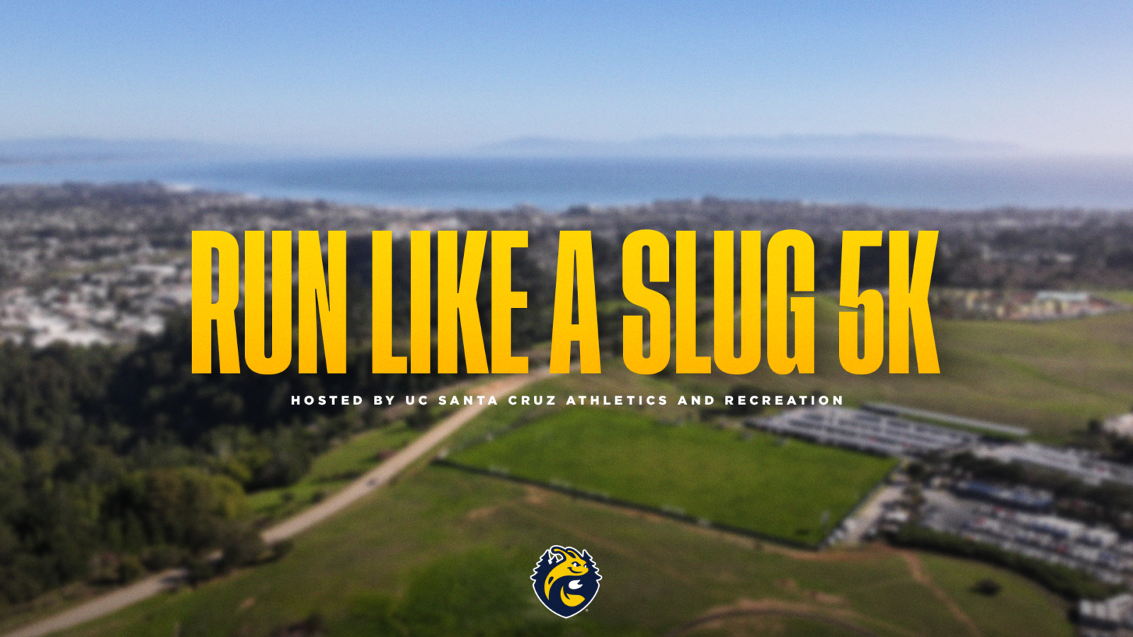 Run Like a Slug 5k, Hosted by UC Santa Cruz Athletics and Recreation and the UCSC Athletics and Recreation logo overlaid on a blurred aerial photo of the UCSC East Field area with the city of Santa Cruz and the Monterey Bay in the background