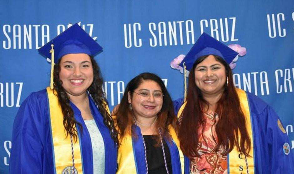 Photograph of three graduates celebrating at the 2025 Women's Center Graduation Ceremony.