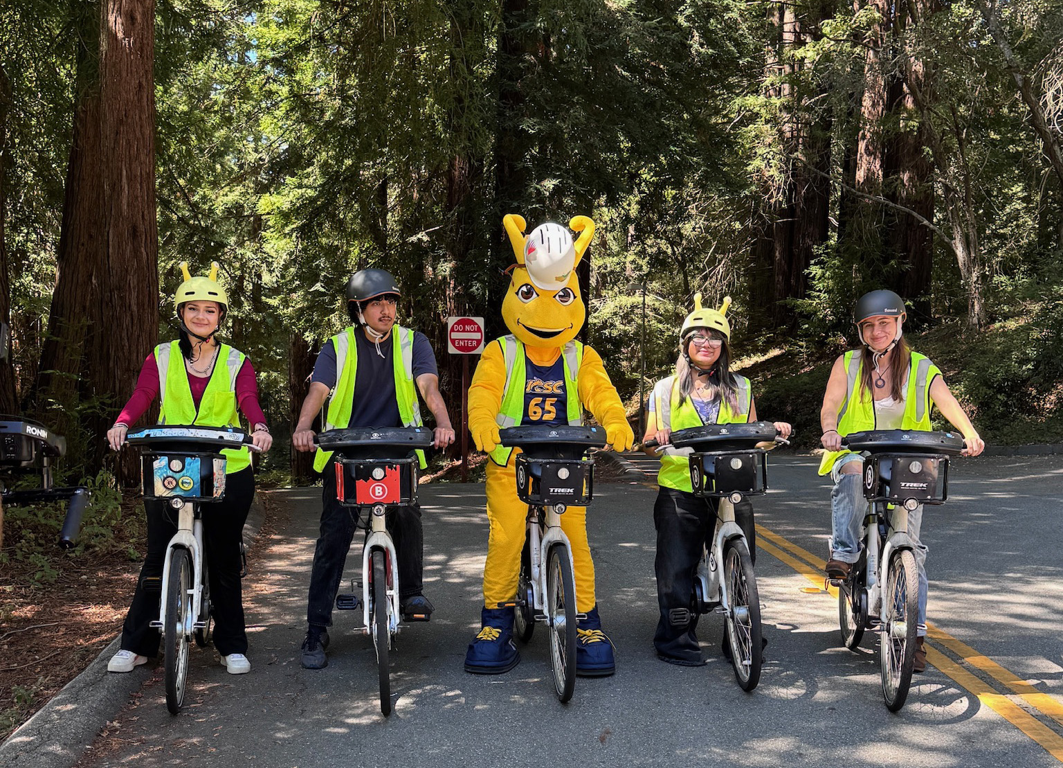 Sammy and Four students on bikes facing toward the camera