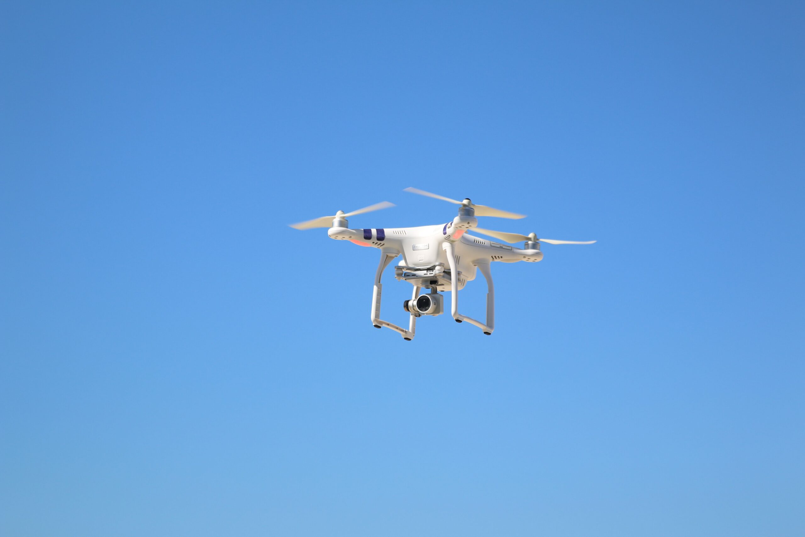 Drone flying in blue skies